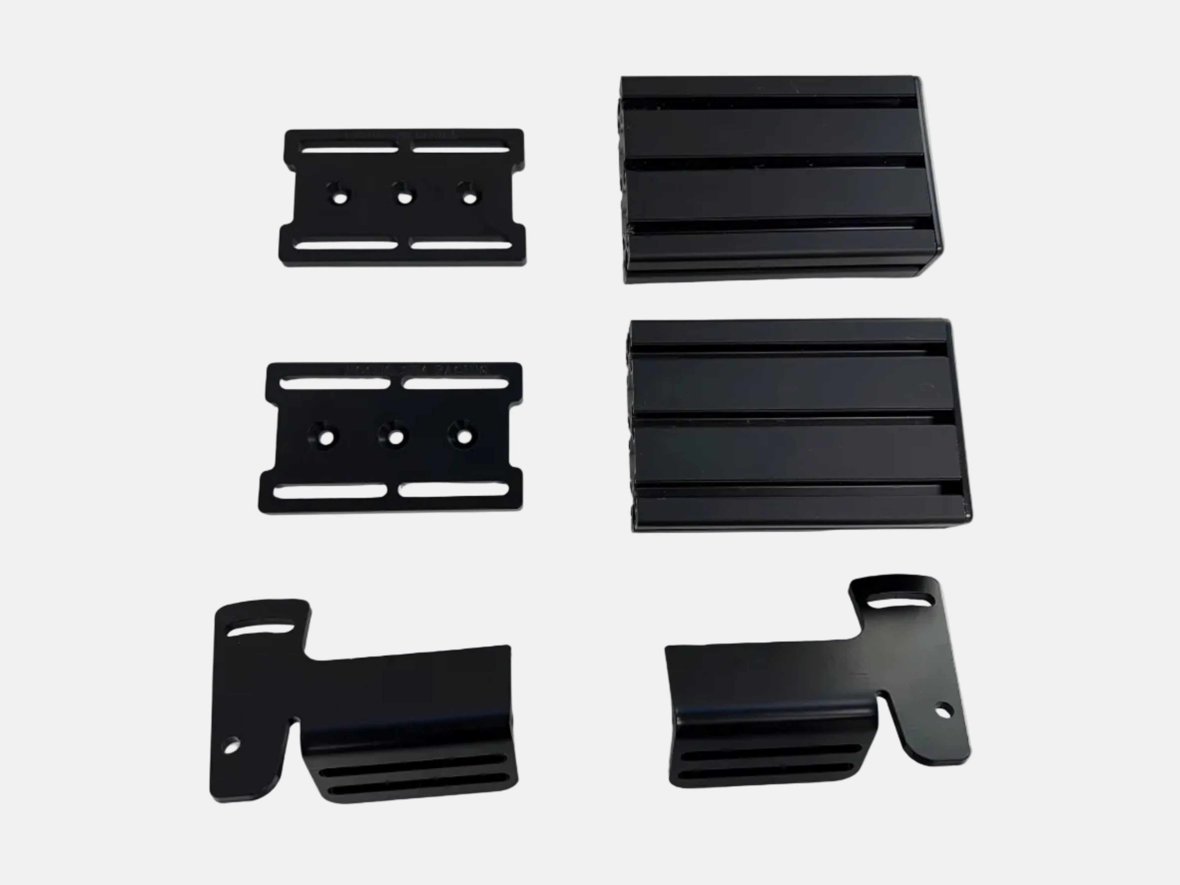 Set of black metal brackets on a white background