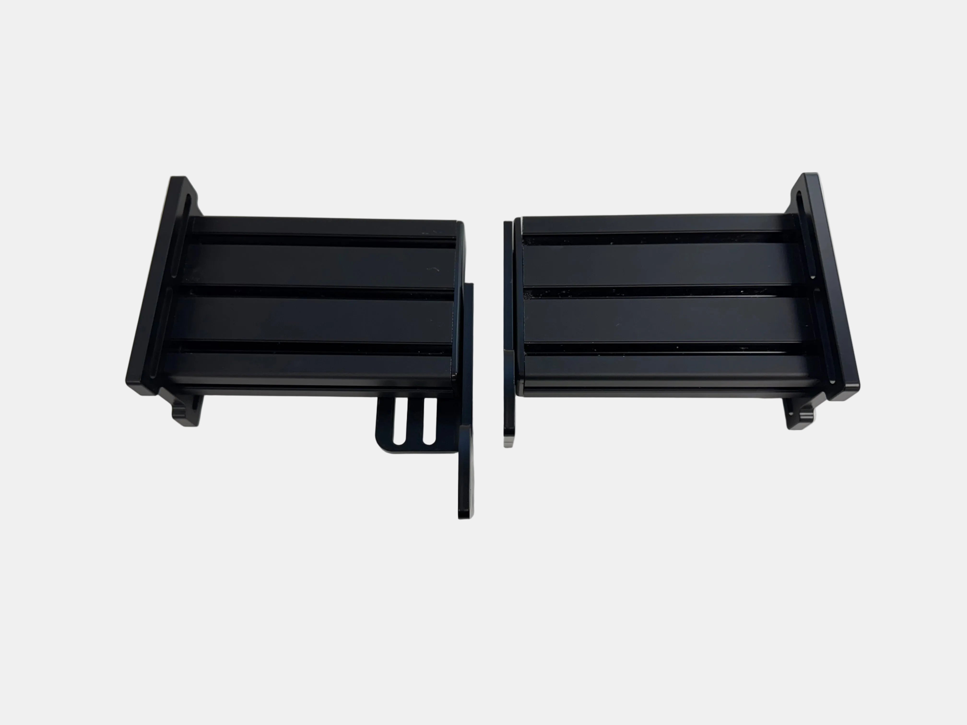 Two black metal brackets on a white background