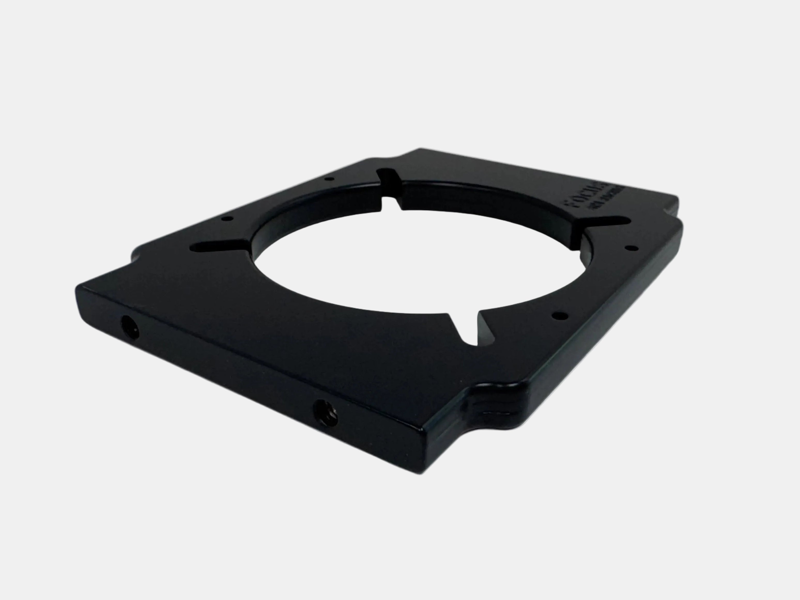 Black metal component on a white background