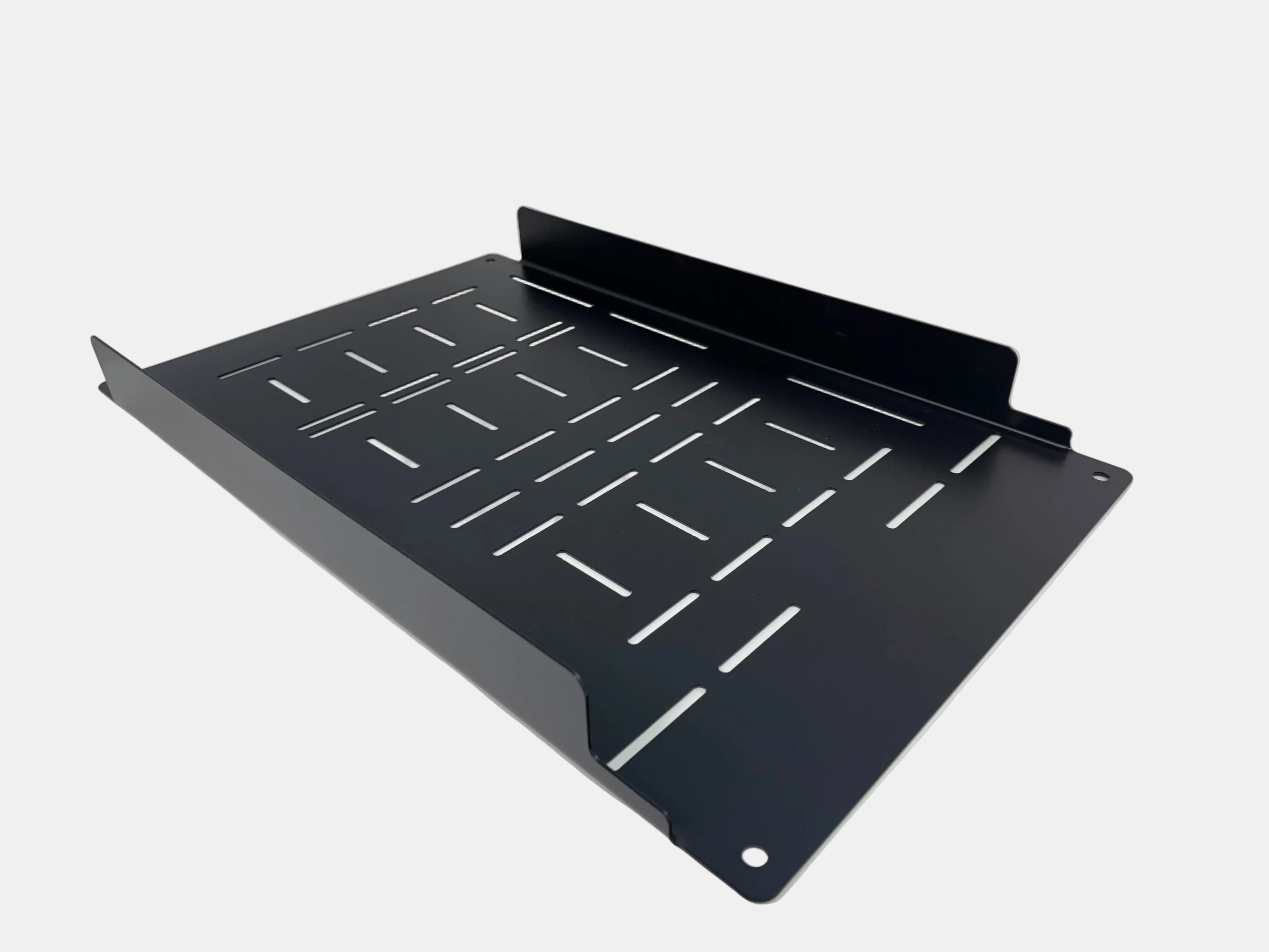 Black metal shelf bracket on a white surface with a gray background